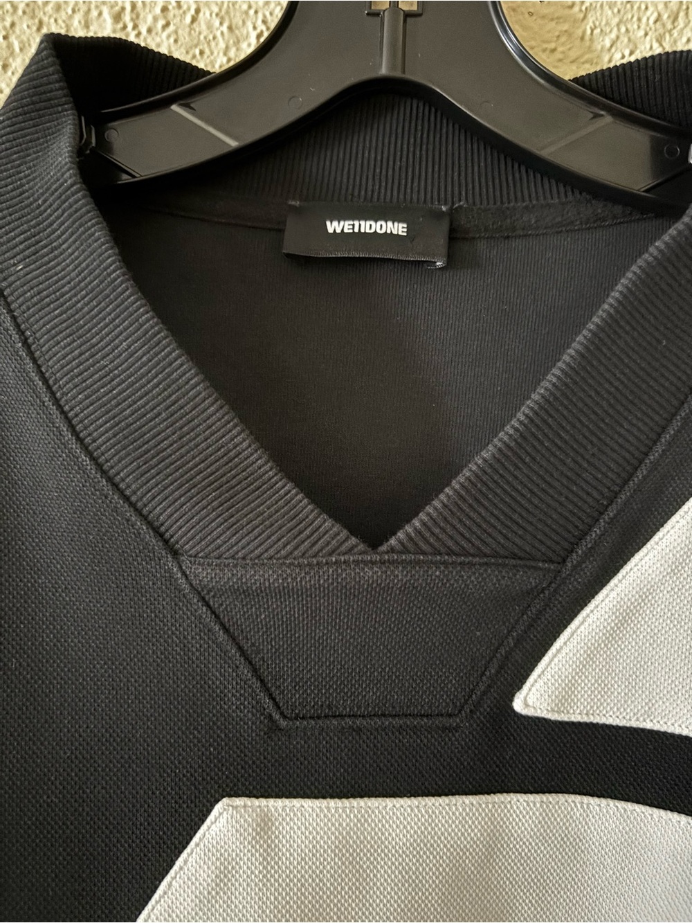 Men's Black V-Neck Sweater with White Geometric Accents - Picture 2 of 7
